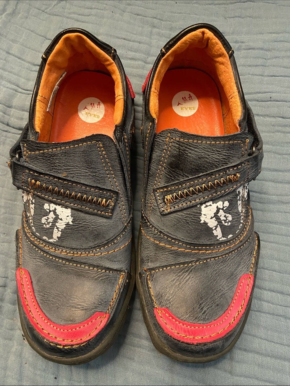 Black Leather Slip-On Flats with Orange Lining and Pink Accents